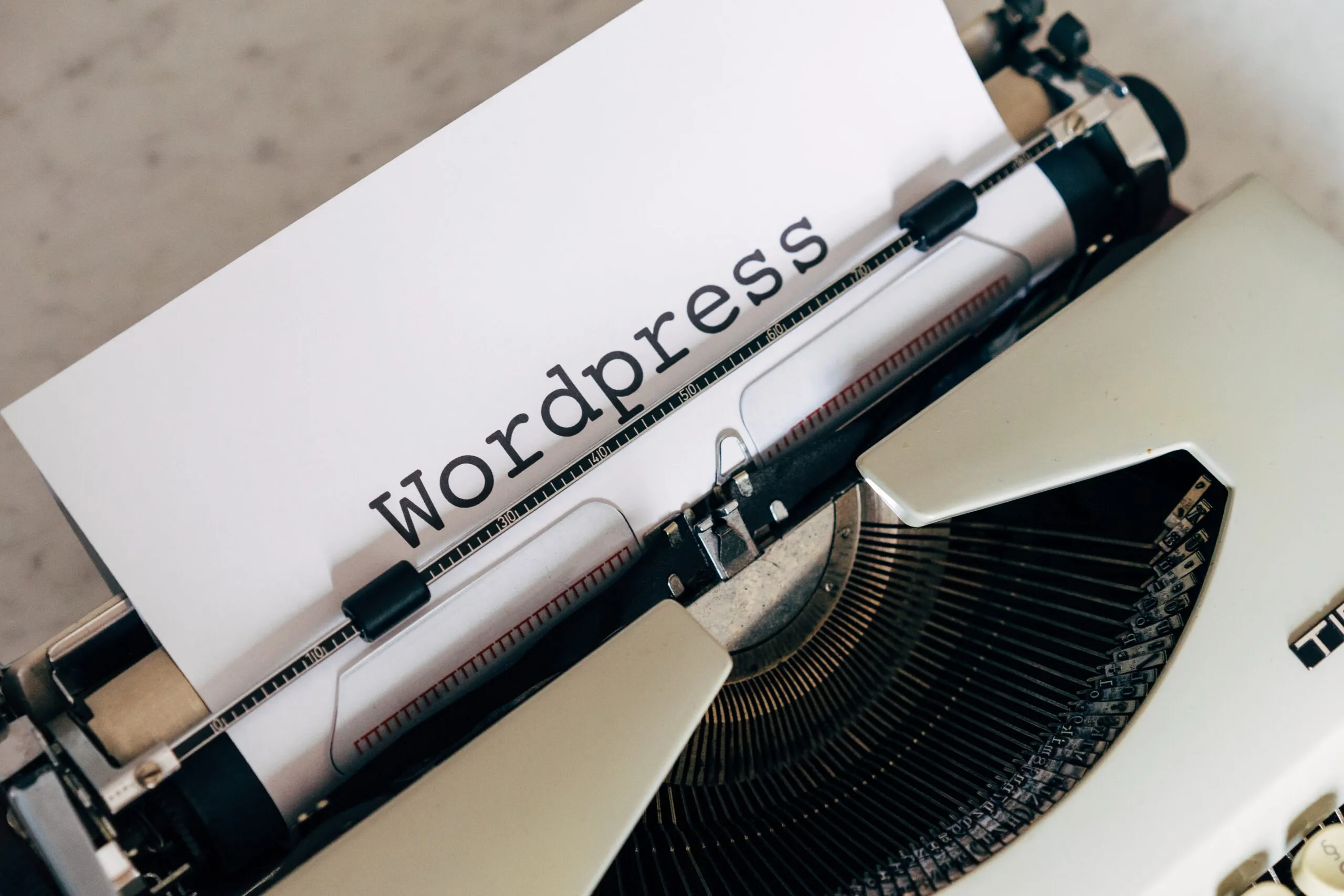 WordPress logo on a laptop screen